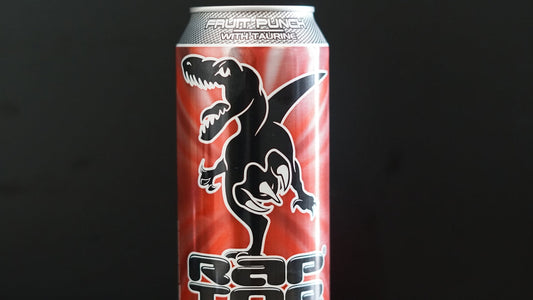 A can of raptor energy drink with a dinosaur graphic.